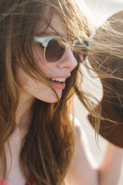 Young happy woman portrait on the beach