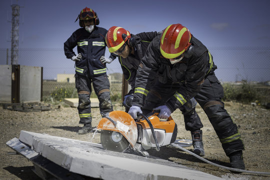 Firefighter practicing with a disc cutter