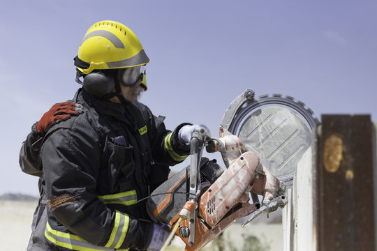Firefighter practicing with a disc cutter