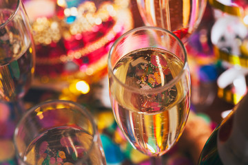 Champagne Glass Of Champagne With Party Things Behind