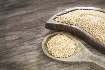 Amaranth seeds on the wooden table (Amaranthus)