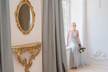 Fashion bride in gray dress with make-up smoky eyes