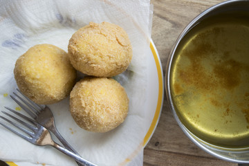 arancine fried in boiling oil