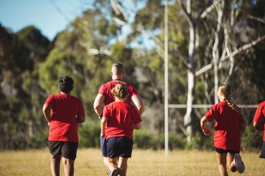 Trainer training kids in the boot camp