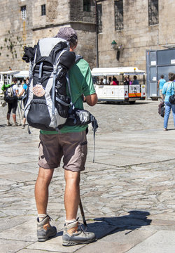Pilgrim arriving in santiago de compostela, on the way to santiago