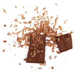 Chopped and chocolate pieces isolated on white background