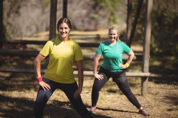 Portrait of happy women exercising during obstacle course
