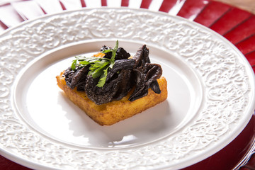 Traditional fried polenta with shitake