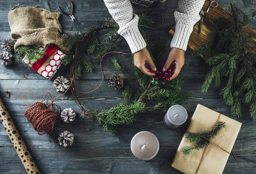 Woman Makes a Christmas Wreath