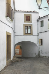 Fototapeta na wymiar Stone and whitewashed houses of Trujillo street