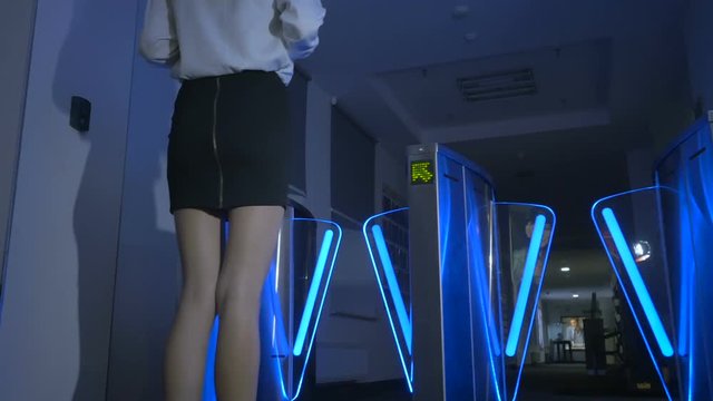 Businesswoman is going through the checkpoint in business center