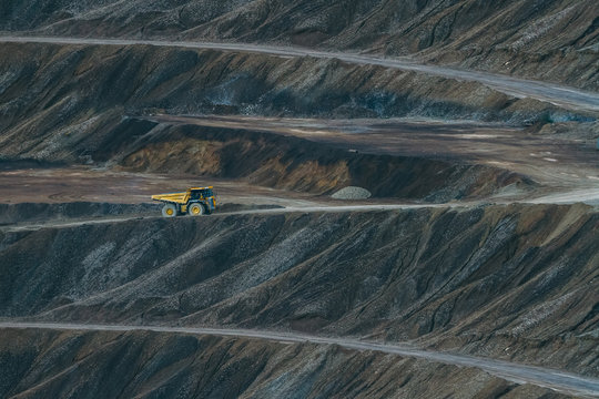 yellow quarry truck in dark moon landscape