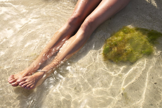 Woman soaking in ocean water