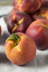 Fototapeta na wymiar Raw Ripe Organic Yellow Peaches