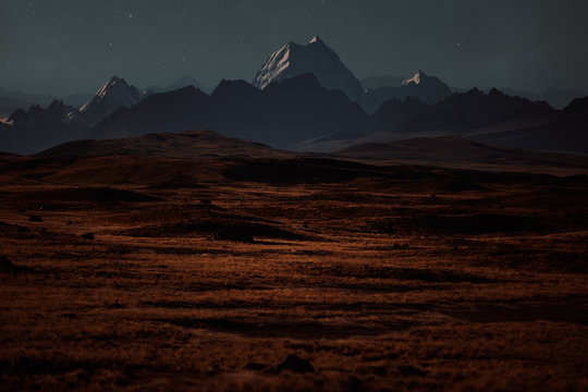 An interstellar landscape with a starry sky