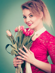 Woman holding bouquet of tulips flowers