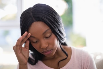 Young woman suffering from headache