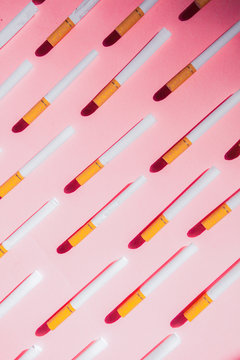 Cigarette pattern on pink background