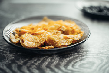 On the black plate are chips