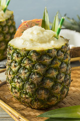 Frozen Pina Colada Cocktail in a Pineapple