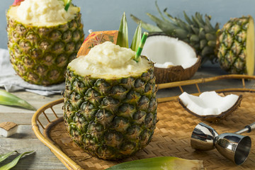 Frozen Pina Colada Cocktail in a Pineapple
