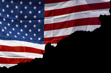 Detail of ragged American Flag isolated on black background