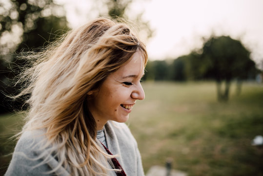 Portrait of a young beautiful woman smiling outdoors