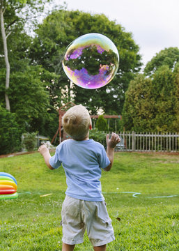 Boy Staring at Bubble 