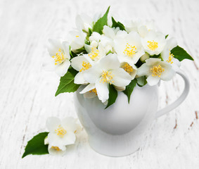 Vase with jasmine flowers