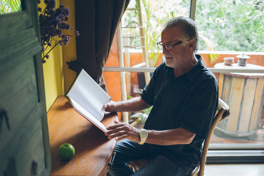 Senior Man Reading at Home