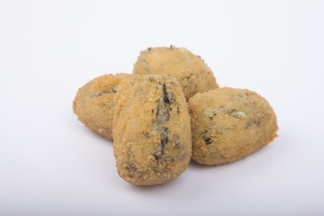 a handful of homemade croquettes of spinach isolated on white