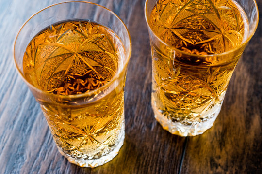 Safran or Koruk serbeti / Saffron Sherbet on dark wooden surface.