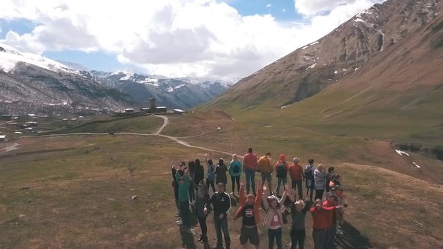 the group of travelers in the mountains are in the circle