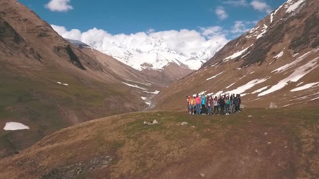 the group of travelers in the mountains are in the circle