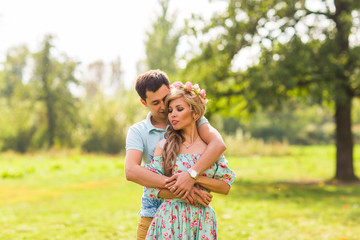 Fototapeta premium happy young couple hugging on nature
