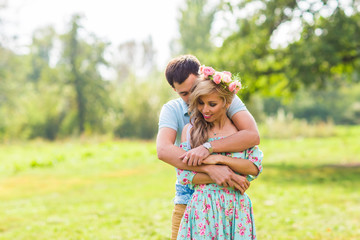 Fototapeta premium Young couple in love hug each other in nature