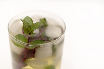 Kentucky derby drink in a glass goblet on a light background.