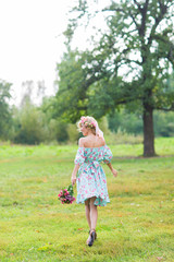 Portrait of a young beautiful woman on the nature