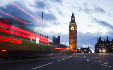 London cityscape at Big Ben, night scene photo with a red bus and traffic