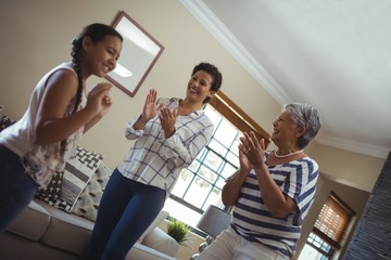 Obraz premium Happy family having fun in living room