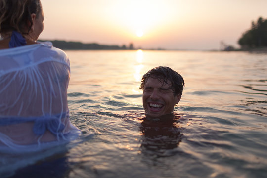 Couple Swimming with Clothes