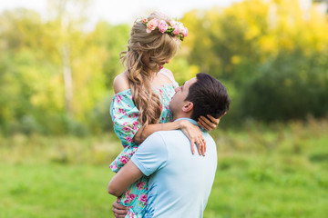 Young couple in love hug each other in nature