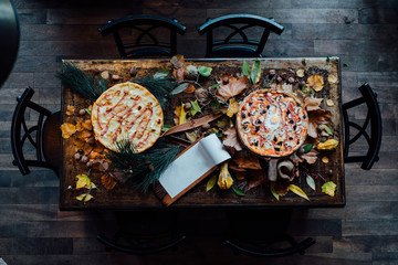 Above shot of table with two pizza