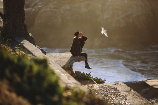 A young beautiful woman exploring on the California coast 