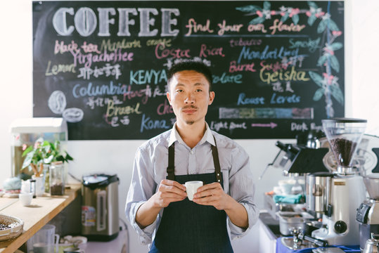 Young man preparing coffee