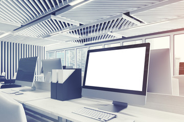 Fototapeta na wymiar Computer monitor in a gray office