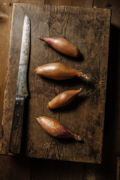 Shallots on chopping board