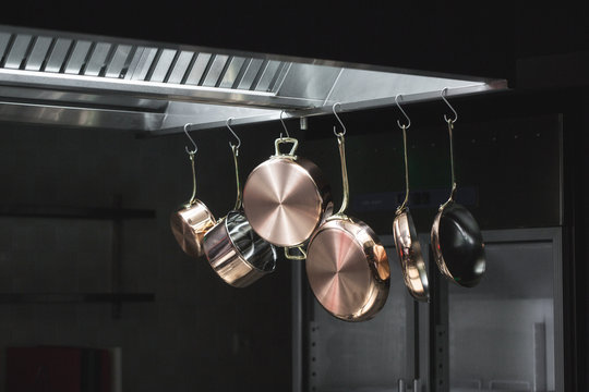 Copper Dishes Hanging in a Kitchen