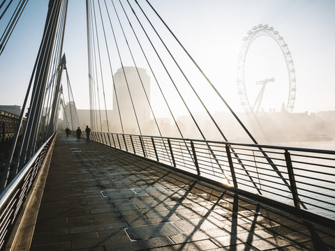 People on a contemporary bridge in London