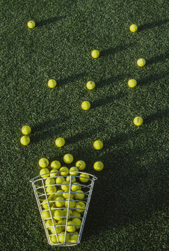 Golf balls in basket on golf course